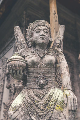 Stone statue carved by hand, embodying cultural heritage and natural beauty.