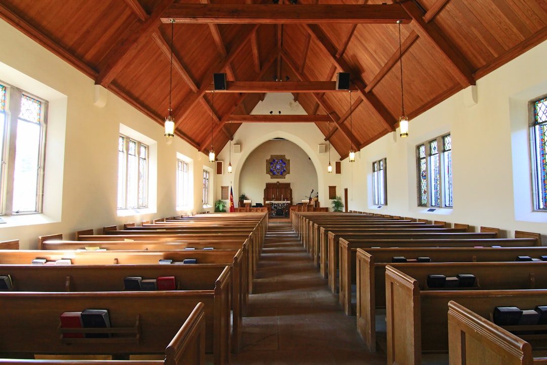 Church donations: A collection plate filled with money, symbolizing the act of giving and support in a place of worship.