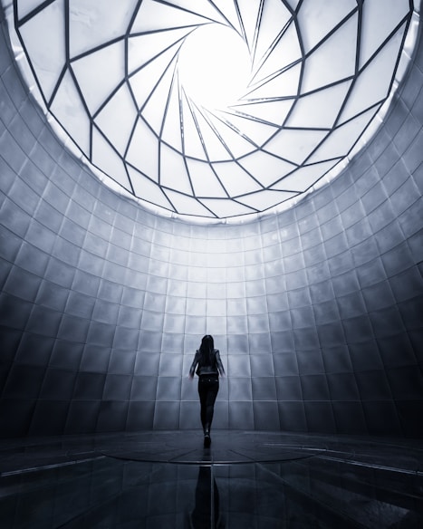 woman wearing black shirt facing the ceiling