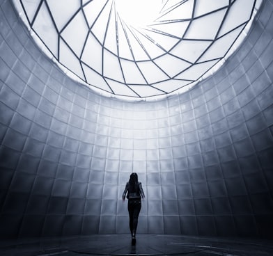 woman wearing black shirt facing the ceiling