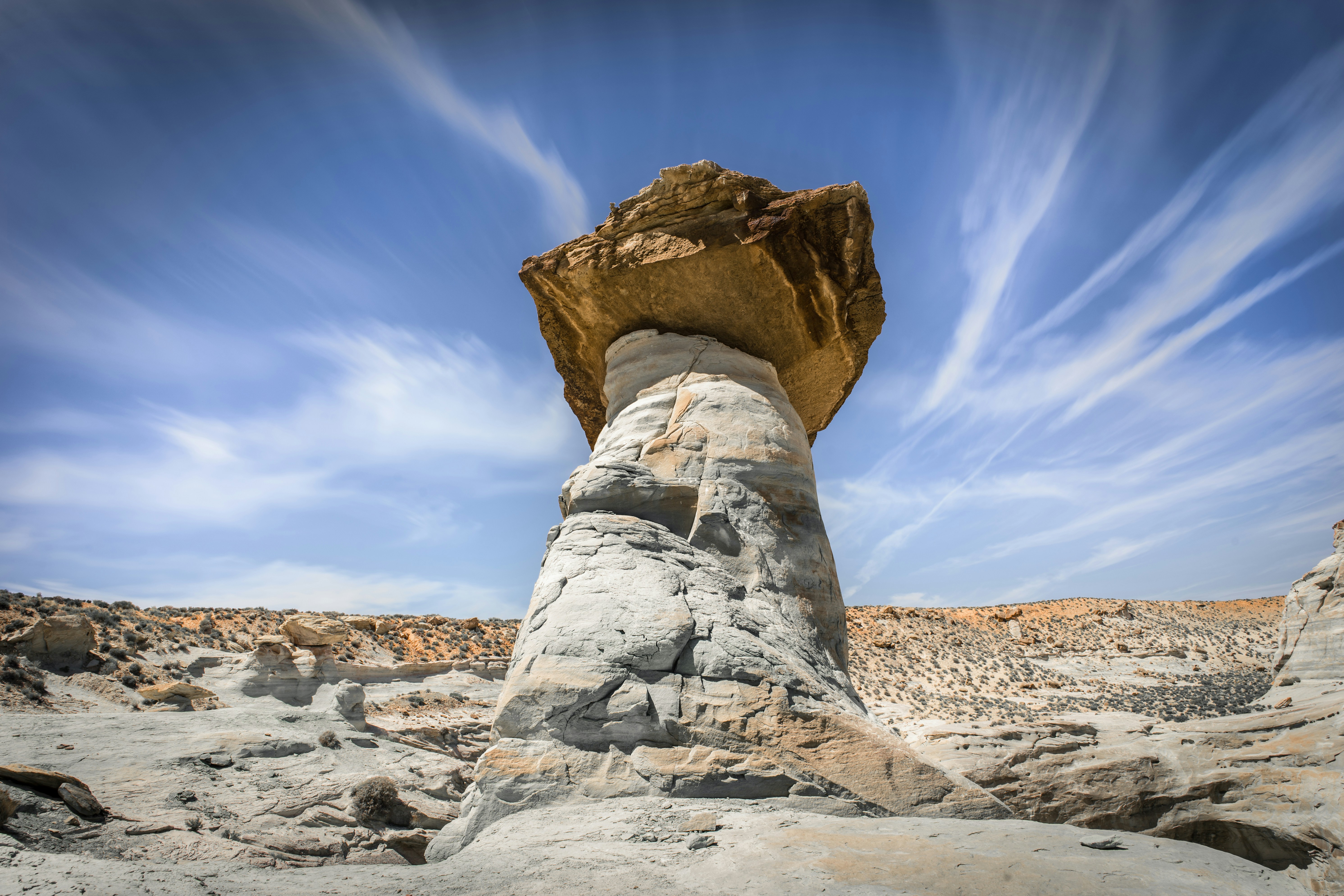 gray and brown rock formation at daytime, These mystical hodos leave you in amazement. This isolated gem puts you in complete isolation and silence. It’s a truly stunning place to take a half hour and reflect. Is it in Arizona, or Utah? Depends on who you ask, but who cares :). It’s awesome.