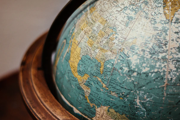 blue earth globe on table