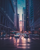 vehicles near buildings at night time