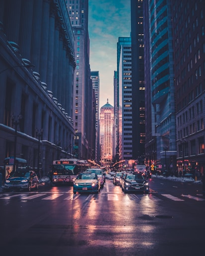 vehicles near buildings at night time