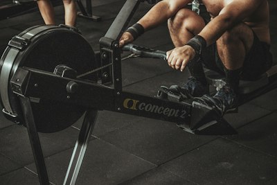 Member working the rowing erg during a conditioning block
