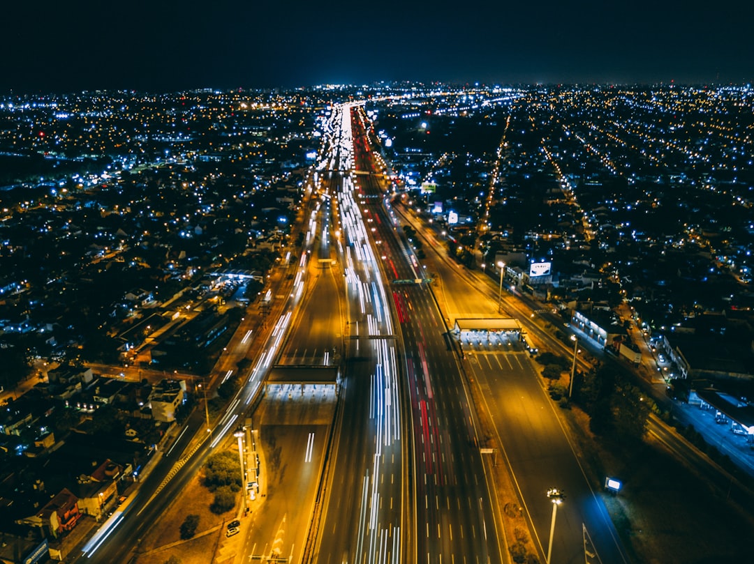 time-lapse photography of city buildings and road, 11pm in Panamericana highway.