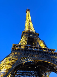 The iconic Eiffel Tower illuminated at night in Paris.
