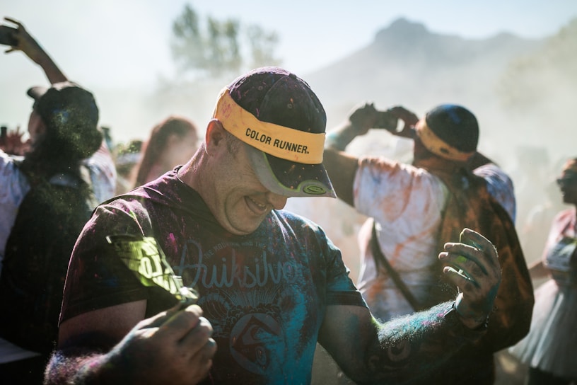Runners joyfully covered in vibrant color powder during the djoeang color run.
