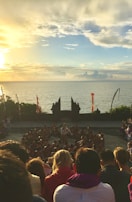 Evening stage session with participants seated in a circle, sharing energy and focus.