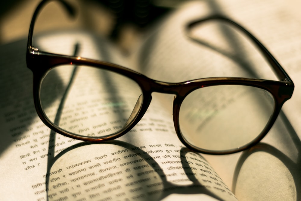 eyeglasses on book