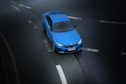 aerial photography of blue sedan on highway