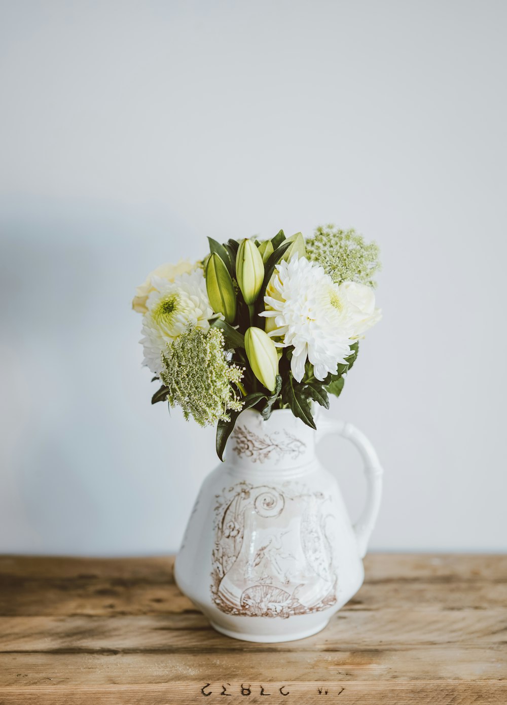 flowers in pitcher vase