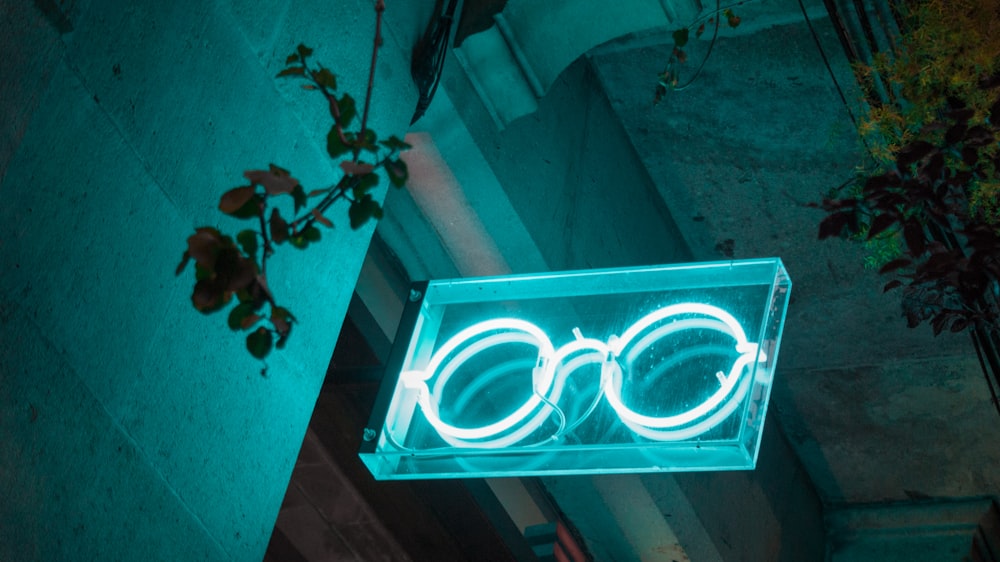 white hippie glasses neon light decor on door