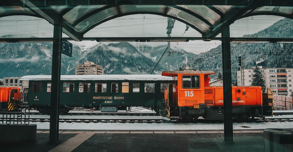 orange train on rail