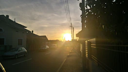 A calm street in Plentzia with houses and natural light at sunset.