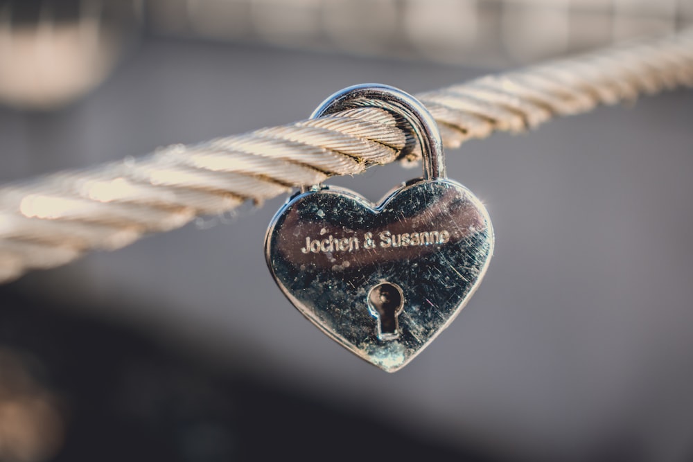 silver-colored heart padlock