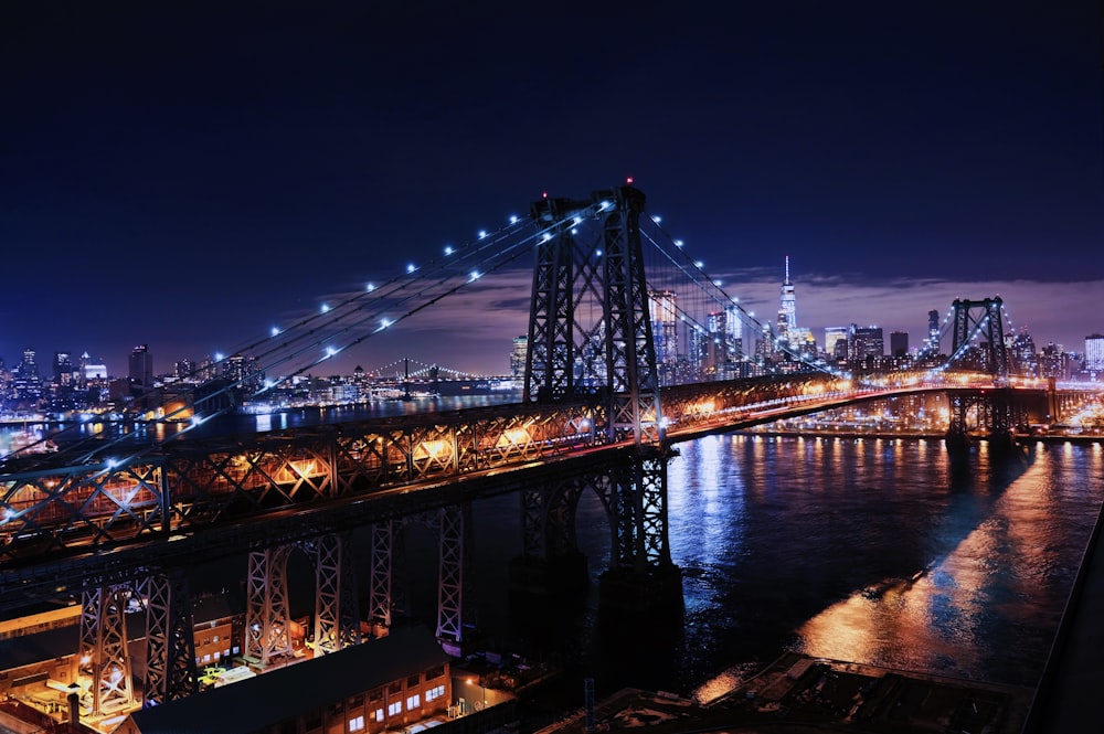 bridge near body of water and building