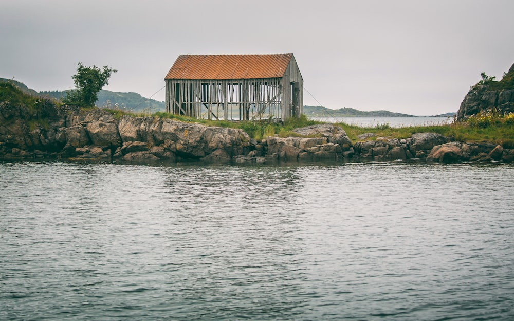 gray house near body of water