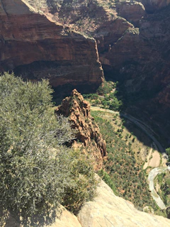 A panoramic view of the beautiful Sianok Canyon with sunlight casting shadows on the cliffs