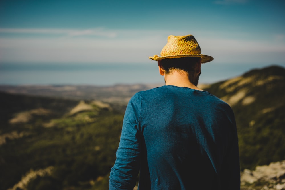 man standing on hill