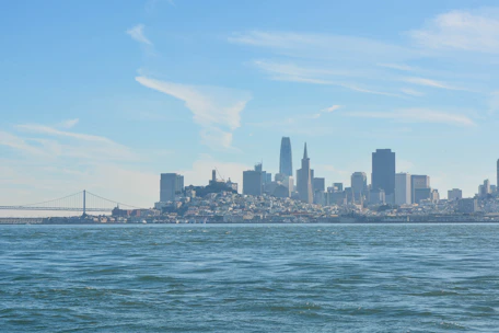 A confident investor reviewing Pemex bond certificates with a city skyline behind.
