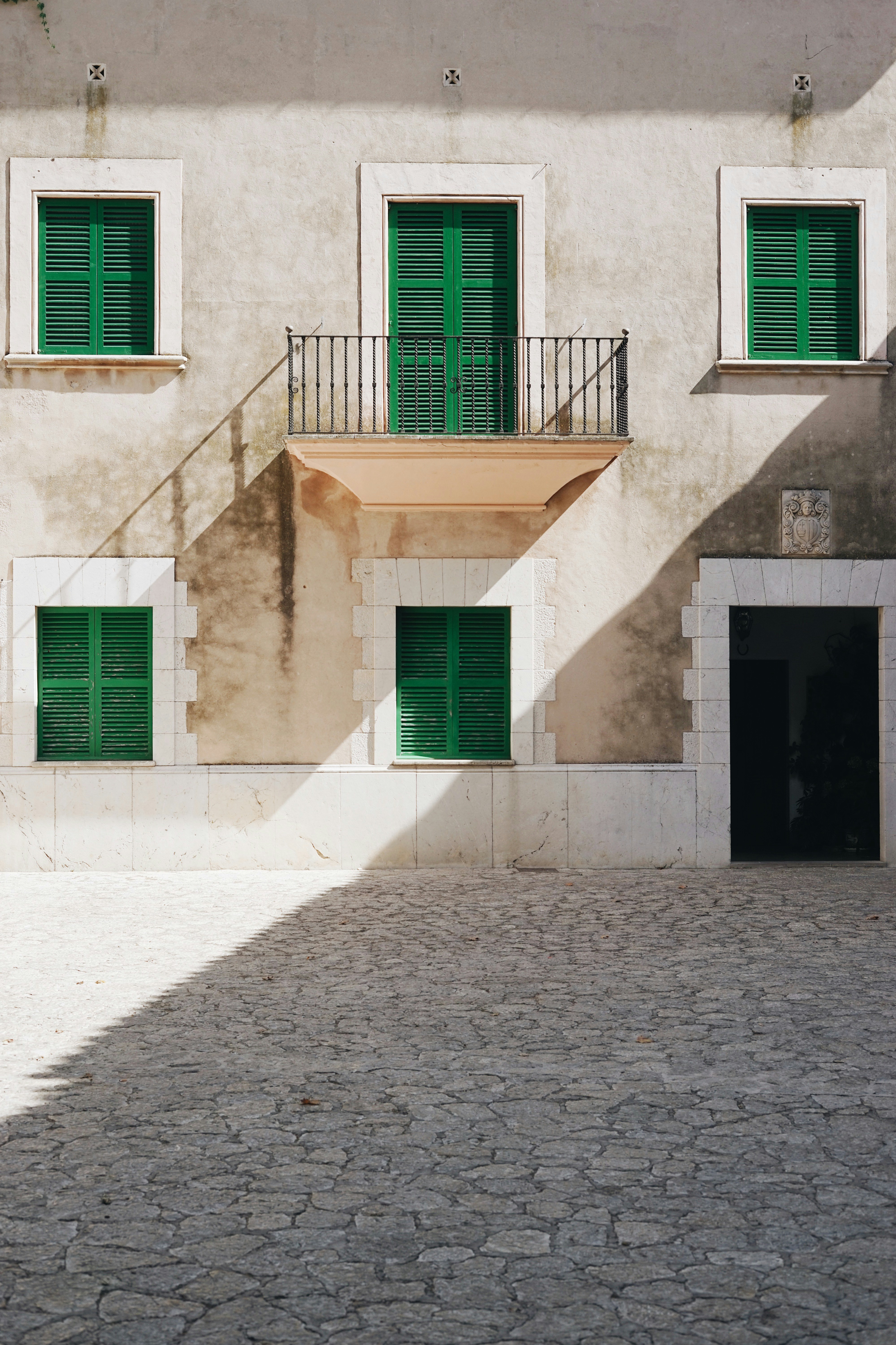 brown and gray concrete 2-storey house during daytime