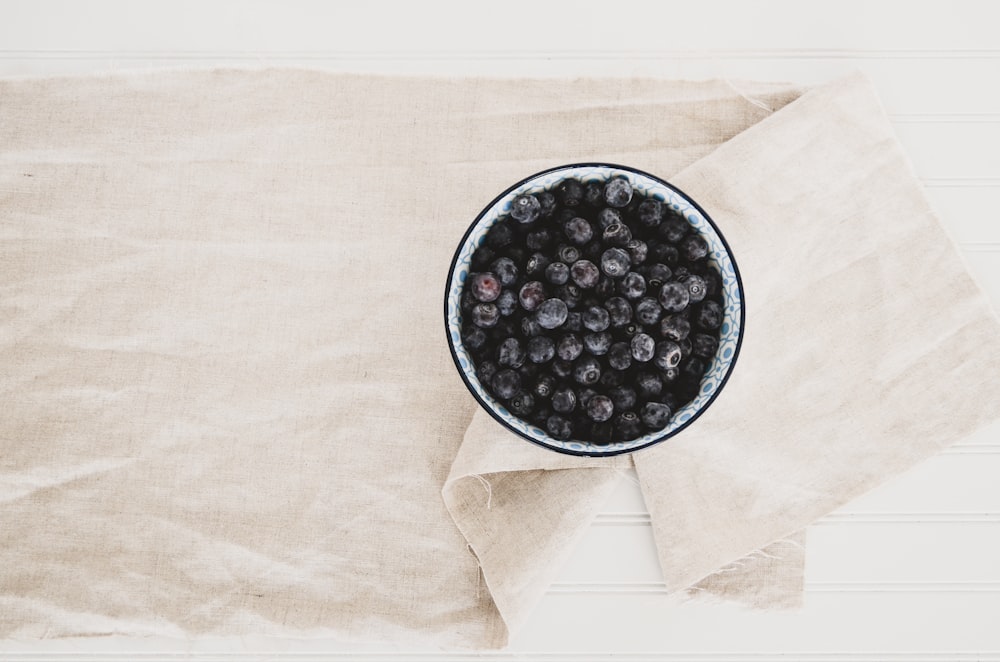 blueberries on gray and black container