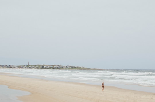 person walking near seashore during daytime in Cabo Polonio Uruguay