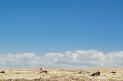 white house under white clouds remote teams background