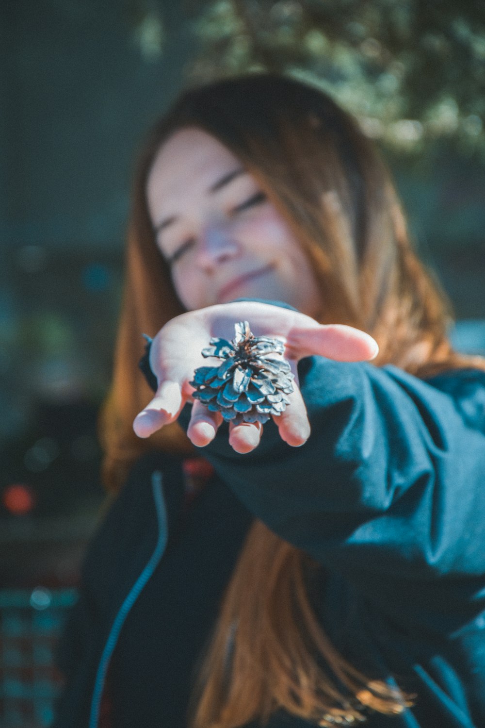 person holding leaf