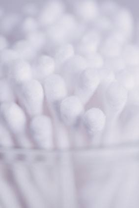 Close-up of cotton swabs and medical supplies on a clean surface