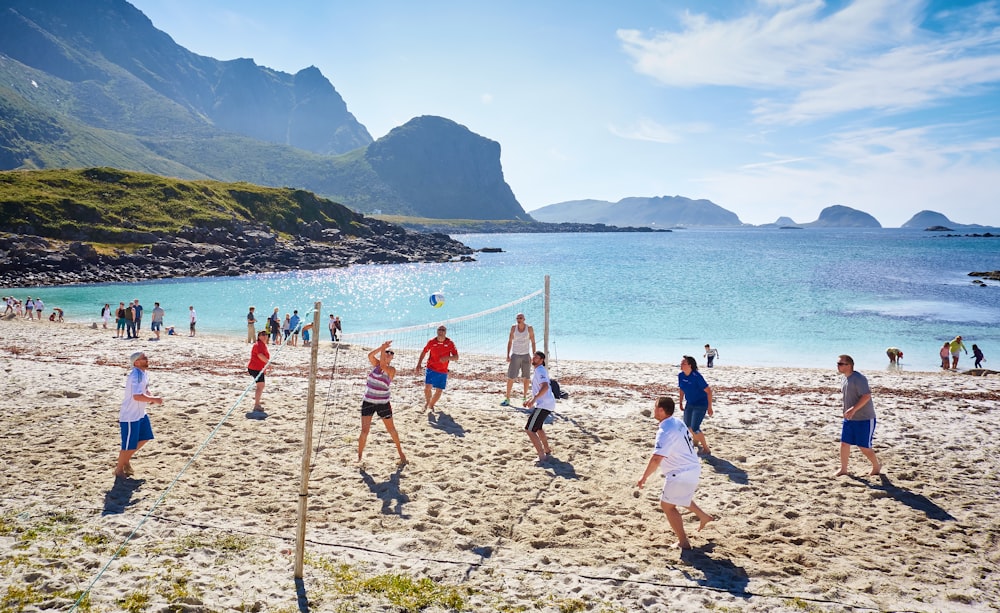 people playing beach volleyball