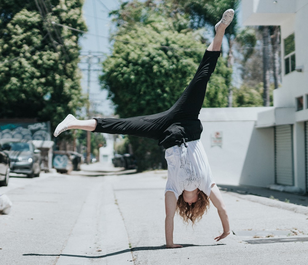 person tumbling on side of the road