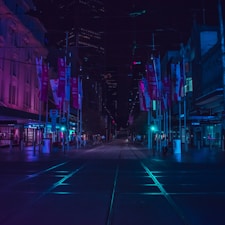 people walking on walkway during nighttime
