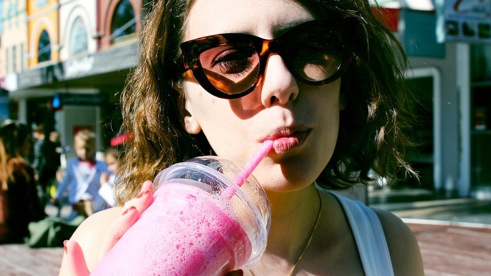 woman drinking strawberry shake