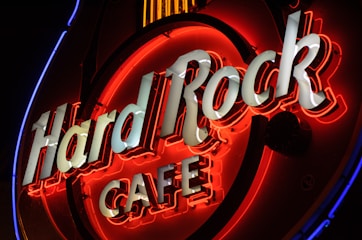 red and black Hard Rock Cafe neon signage
