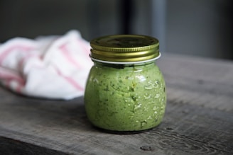 clear glass jar on gray surface