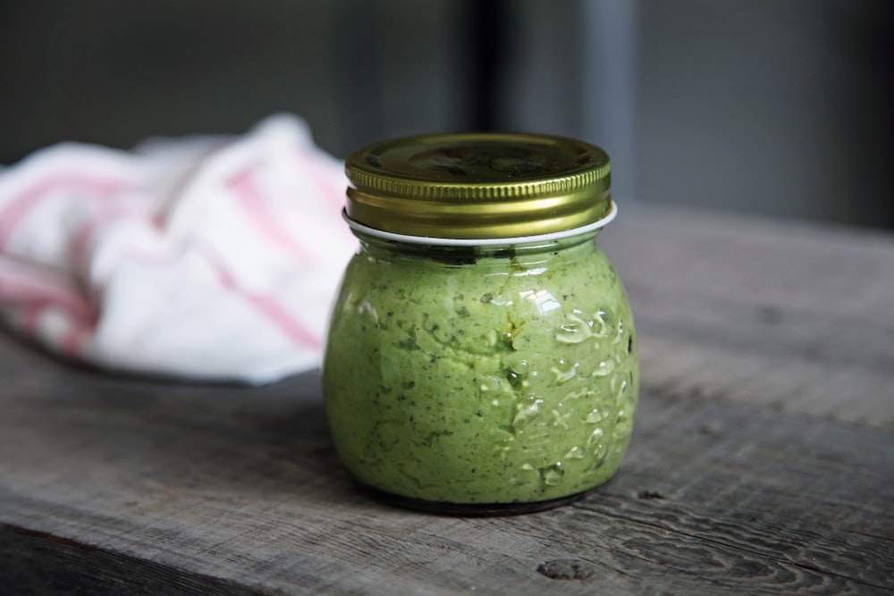 clear glass jar on gray surface