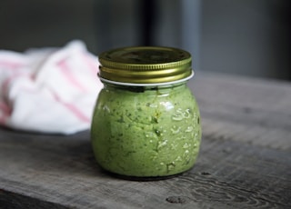 clear glass jar on gray surface