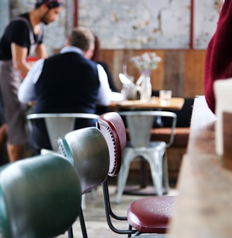 a couple of people sitting at a table in a room