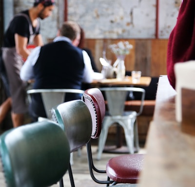 a couple of people sitting at a table in a room