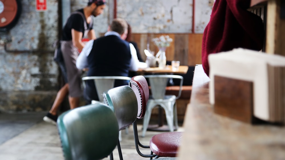 a couple of people sitting at a table in a room