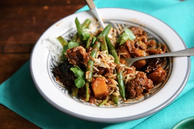 meat with vegetable on plate plate teams background