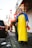 man standing beside a road