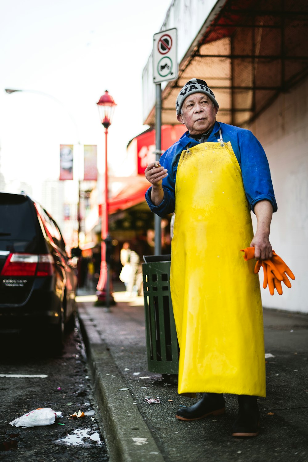 man standing beside a road