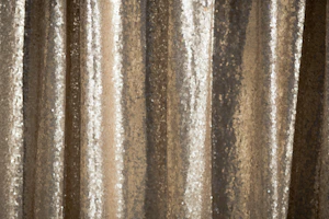 gold architectural sequin basque catching light, highlighting its intricate design