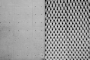 Side-by-side comparison of a grimy concrete walkway and the freshly cleaned result.