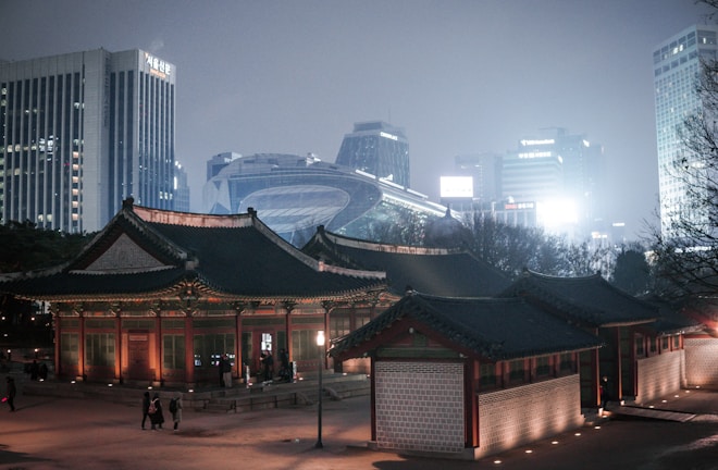 A cozy evening view of Seoul's skyline illuminated by city lights.