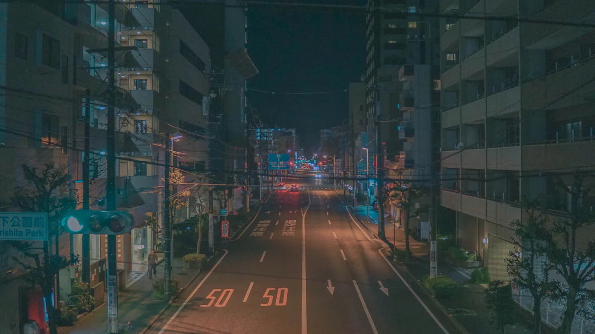 A rain-slicked street at night, reflected in the window of a passing car, capturing the moody, isolated atmosphere of the city.