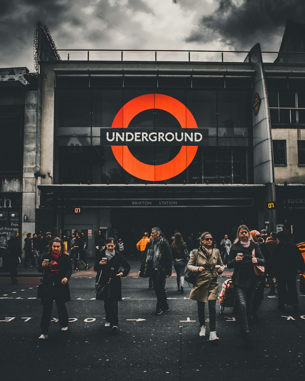 people walking in front of Underground labeled building